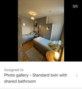 a hotel room with two beds in a room at Rooms Anfield- 5 mins from LFC in Liverpool