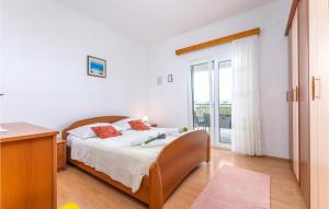 Postel nebo postele na pokoji v ubytování Holiday Apartment Suhi Potok 07