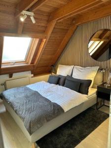 En eller flere senge i et værelse på Ferienappartements Thomas Heindl