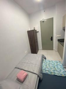 Postel nebo postele na pokoji v ubytování Mini Studio in Batu Kawan