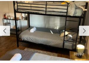a room with two bunk beds in a room at Rooms Anfield- 5 mins from LFC in Liverpool