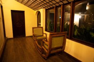 Posezení v ubytování Carmelia Haven Resort Thekkady