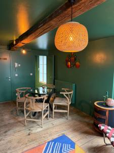 a dining room with a table and chairs at Cosy Boudoir Suites - 4p in Antwerp