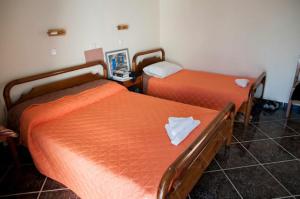 Postel nebo postele na pokoji v ubytování Eleni Hotel