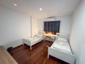 Postel nebo postele na pokoji v ubytování TarTar & Nay Hostel
