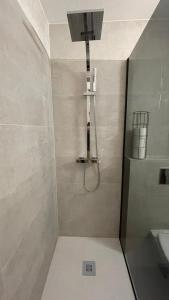 a bathroom with a shower and a sink at Appartement confortable 4 personnes à 10 min de strasbourg - Parking inclus in Schiltigheim +6 photos