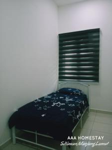 Ένα ή περισσότερα κρεβάτια σε δωμάτιο στο AAA homestay