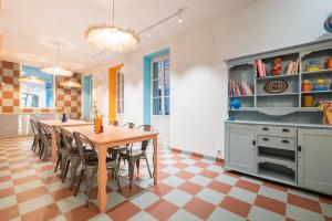 a kitchen with a table and chairs in a room at Résidence Kley Marseille République in Marseille +10 photos