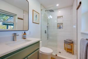 a bathroom with a shower and a sink and a toilet at BBQ Ready and Fire Pit Chic Johnson City Home in Johnson City +22 photos
