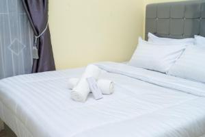 Ένα ή περισσότερα κρεβάτια σε δωμάτιο στο Gunter Homestay