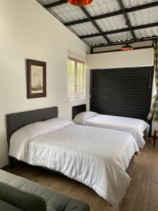 Postel nebo postele na pokoji v ubytování INLOFT Quindío + 37 fotografií