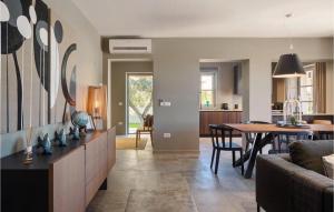 a living room with a table and a dining room at Villa Fendt 2 in Poreč