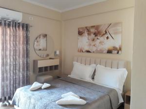 Postel nebo postele na pokoji v ubytování Qiqi Hotel
