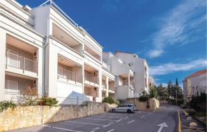 a car parked in a parking lot in front of buildings at Amazing Apartment In Selce With Wifi in Selce