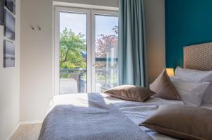 Giường trong phòng chung tại Wiesenkieker am Ostseestrand