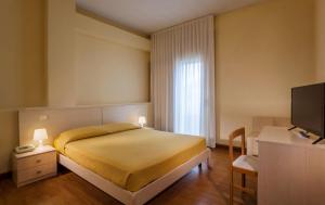 Postel nebo postele na pokoji v ubytování Hotel B&B Risorta