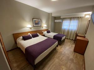Llit o llits en una habitació de Hotel Centro 16 fotos més