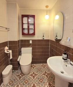 a bathroom with a toilet and a sink at Stay Dongdaegu in Daegu