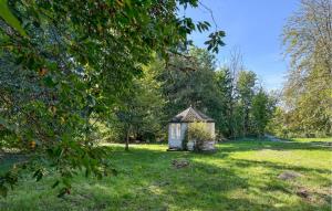 a small shed in the middle of a grass field at 4 Bedroom Stunning Home In Ryd in Ryd +16 photos