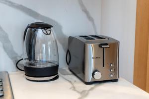 Köök või kööginurk majutusasutuses Gauthier Luxe , 1BR Apart- Comfort & Style in Casa