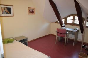 Postel nebo postele na pokoji v ubytování Gästehaus Sankt Franziskus