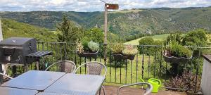 a table and chairs on a balcony with a view at Exklusive Ferienwohnung Lurelei 150 qm mit Traumblick 4 bis 9 P in Bacharach