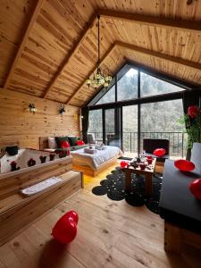 a large room with a bed and a table at HiraBungalov in Çamlıhemşin