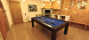 a room with a pool table in a kitchen at Catalunya Casas Stunning Villa with private pool 33 km to Barcelona in Senmanat