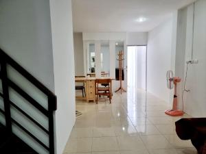 a living room and dining room with a table at Jonah by The Sea Hideaway Cabin in Ban Sam Maitri +29 photos