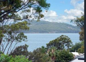 a view of a large body of water with trees at Urban Oasis in Toronto