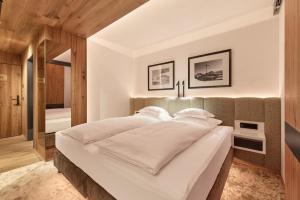 Postel nebo postele na pokoji v ubytování Hotel Auriga