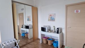 Kuchyň nebo kuchyňský kout v ubytování OLEANDRI SUITE B&B + 1 fotografie