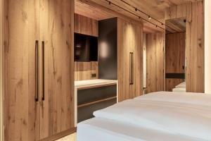Postel nebo postele na pokoji v ubytování Hotel Auriga