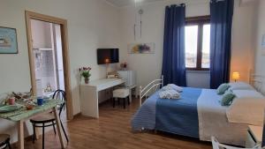 Postel nebo postele na pokoji v ubytování OLEANDRI SUITE B&B
