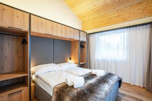 Postel nebo postele na pokoji v ubytování SWISSPEAK Resorts Thyon 4 Vallées