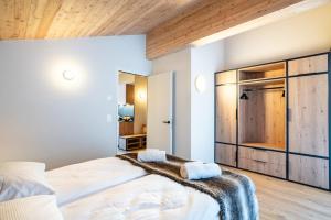 Postel nebo postele na pokoji v ubytování SWISSPEAK Resorts Thyon 4 Vallées
