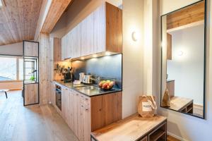 Kuchyň nebo kuchyňský kout v ubytování SWISSPEAK Resorts Thyon 4 Vallées