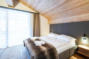 Postel nebo postele na pokoji v ubytování SWISSPEAK Resorts Thyon 4 Vallées