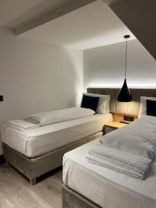 Postel nebo postele na pokoji v ubytování Hotel Wilder Mann