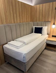 Postel nebo postele na pokoji v ubytování Hotel Wilder Mann