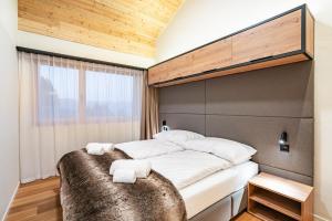 Postel nebo postele na pokoji v ubytování SWISSPEAK Resorts Thyon 4 Vallées