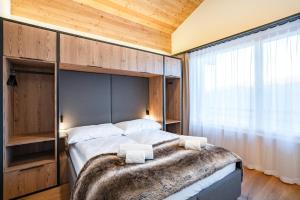Postel nebo postele na pokoji v ubytování SWISSPEAK Resorts Thyon 4 Vallées