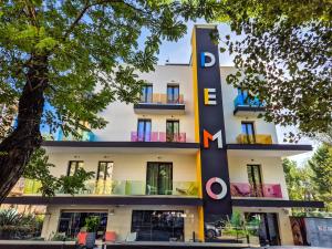 a building with a large sign on it at Demo Hotel Design Emotion in Rimini