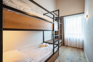 Postel nebo postele na pokoji v ubytování SWISSPEAK Resorts Thyon 4 Vallées