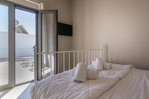 Postel nebo postele na pokoji v ubytování Villa Basilio