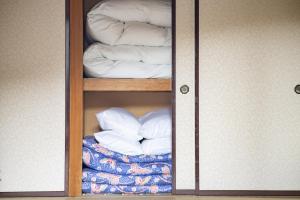 Postel nebo postele na pokoji v ubytování Yuzawa house2