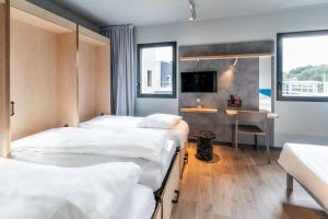 Postel nebo postele na pokoji v ubytování ibis budget Morlaix + 37 fotografií