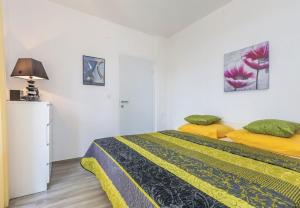 Posteľ alebo postele v izbe v ubytovaní Apartments Ivni