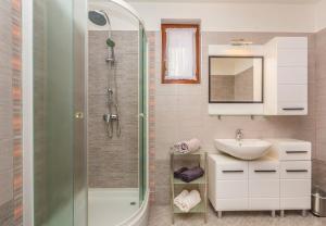 Kúpeľňa v ubytovaní Apartments Ivni