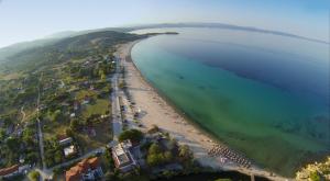 an aerial view of a beach and the ocean at Dasea Houses in Ormos Panagias